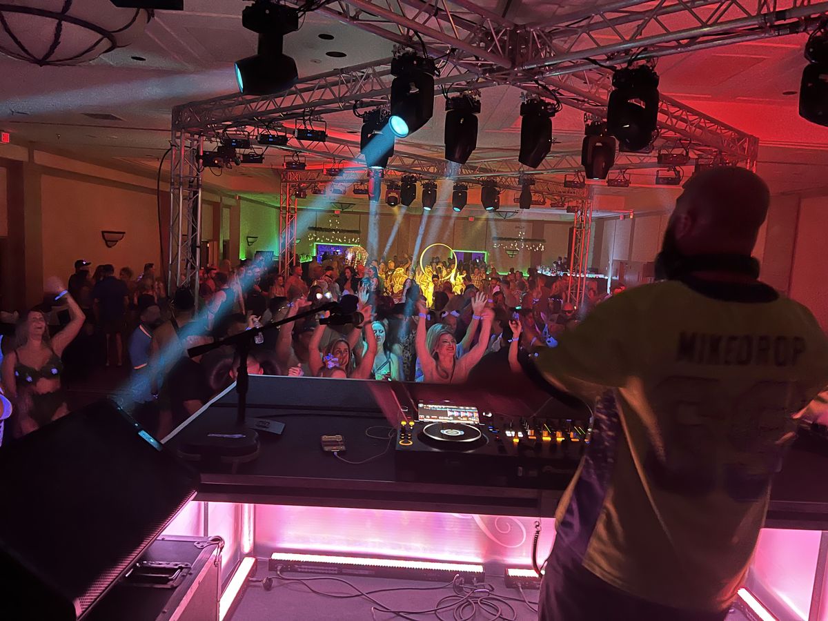A DJ playing to a festival crowd