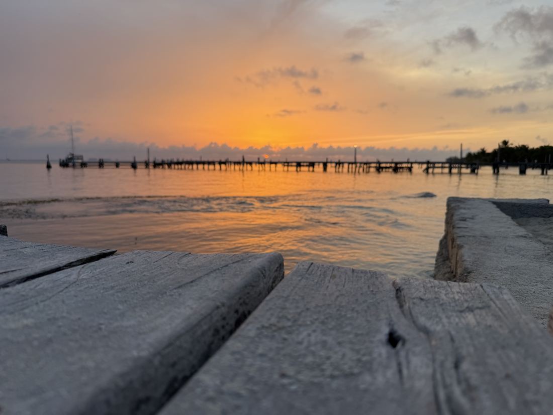 Sunset over the bay from a wooden pier