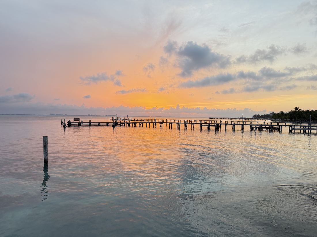 Pastel sunset across calm water